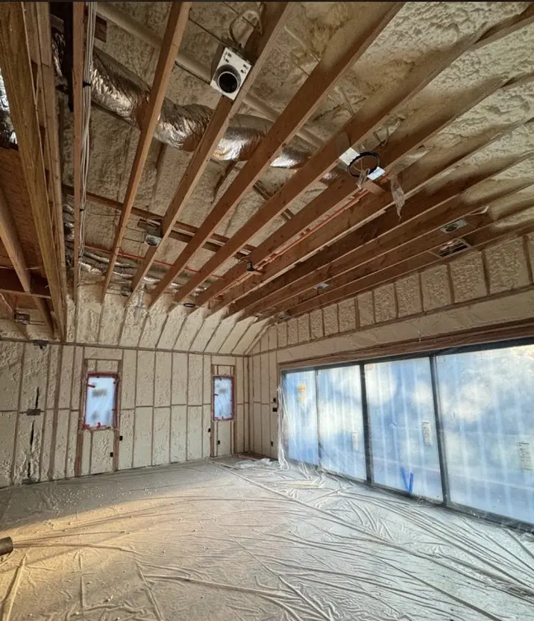 Interior walls and ceiling insulated with spray foam during new construction in Cresaptown